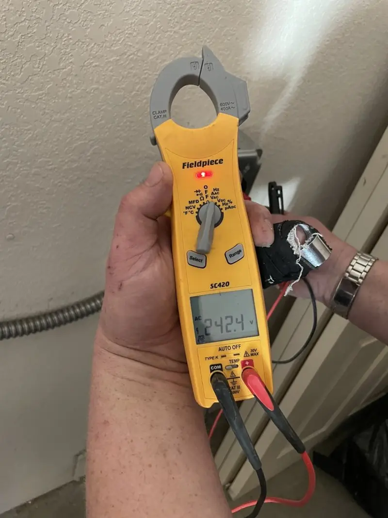 Voltage testing with clamp meter during Circuit Breaker Repair in Golden Valley